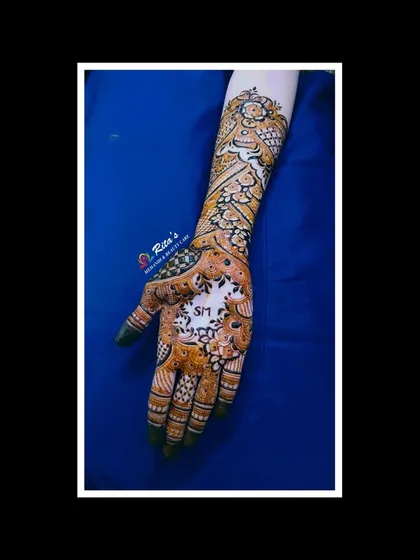 A single-hand view, perfect for seeing the detailed floral and peacock patterns up close.