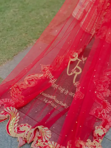 Your story is in the details. For this bride, I helped design a personalized veil embroidered with a meaningful Sanskrit verse and their wedding date, a bespoke touch that weaves their personal saga directly into the fabric of their day.