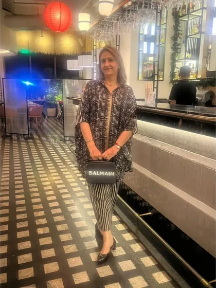 Here is our Lazy Circular Set out in the wild. I love seeing how you style my pieces. This black and white printed co-ord with its relaxed fit and striped pants is perfect for an elegant evening out.