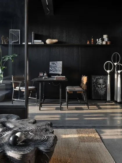A detail of the principal architect's cabin, featuring a sculptural wooden coffee table and curated art pieces.