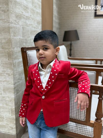 Confidence in red. This jacket is designed to be a showstopper, whether at a birthday party or a family gathering.