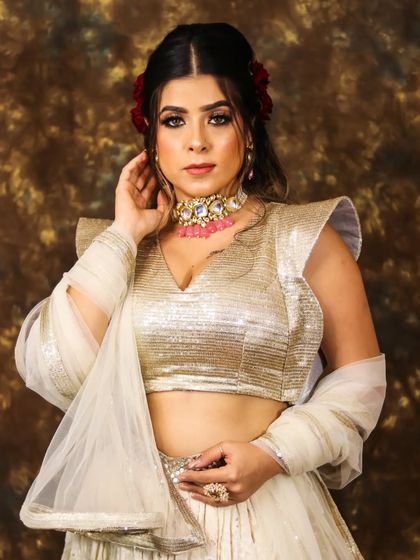 Bringing out her natural radiance. This portrait showcases the beautiful balance between the dramatic eye makeup and the soft, glowing skin.