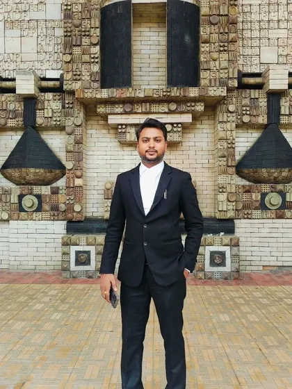 Posing in front of the distinctive architecture of the Delhi High Court. I am familiar with the processes and environment of the court, which helps in navigating cases smoothly.