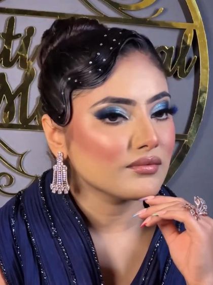 We love a good throwback. These classic finger waves paired with a modern updo and bold blue makeup create a stunning fusion look for a themed party or cocktail night.