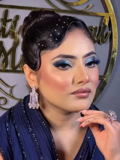 We love a good throwback. These classic finger waves paired with a modern updo and bold blue makeup create a stunning fusion look for a themed party or cocktail night.