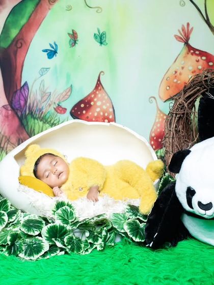 A magical scene with a baby chick sleeping in an egg, surrounded by friendly pandas.
