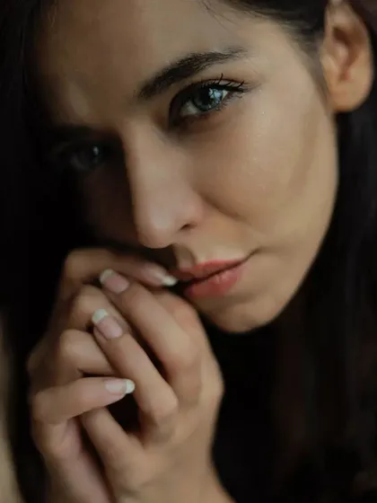 This is a moody, intimate portrait where I used natural, soft light to highlight her contemplative expression. The focus is on the quiet intensity in her eyes, creating a portrait that feels both powerful and personal, a style I love for fashion photography.