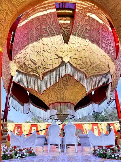 Inspired by the shape of a blooming lotus, this majestic mandap was a true showstopper. The intricate golden petals open up to reveal the ceremony space, surrounded by water for a tranquil and royal feel.