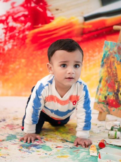 An artist on the move. This action shot captures the energy and fun of the creative painting session.