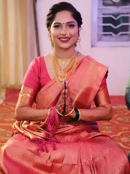 The bride-to-be in a moment of prayer, her traditional look perfect for the auspicious occasion.