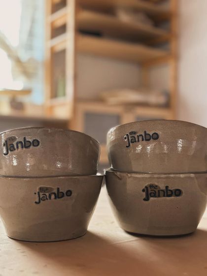 A stack of our custom bowls, showing the beautiful, earthy glaze.