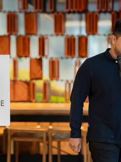 A poet reads from his book, contributing to the Mother's Day theme. Love for mothers is never on a schedule, and our poets showed it.