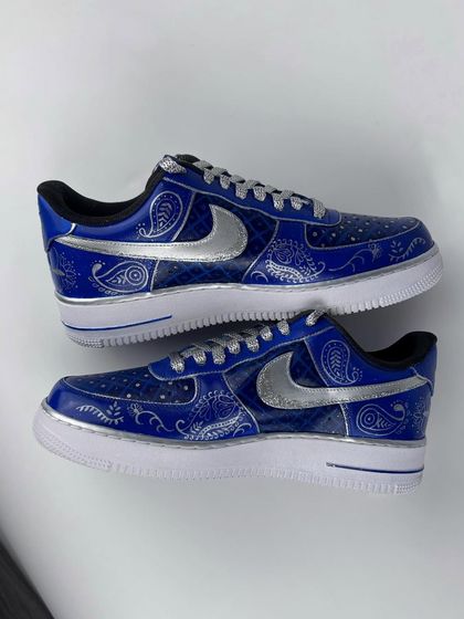 A pair shot of the intricate blue and silver wedding sneakers.