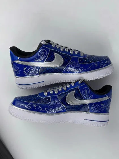 A pair shot of the intricate blue and silver wedding sneakers.