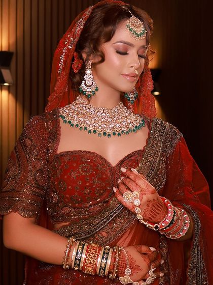 The complete look, showcasing the intricate details of the blouse, the stunning jewelry, and the flawless bridal makeup.