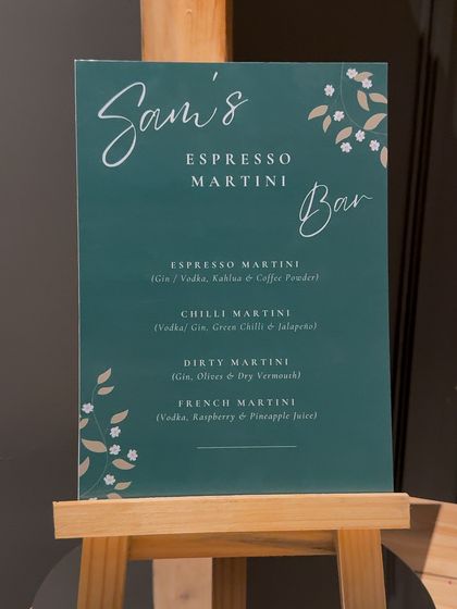 We design every element to be cohesive, including the menus. This custom cocktail menu for "Sam's Espresso Martini Bar" features elegant typography and illustrations that match the party's sophisticated vibe.