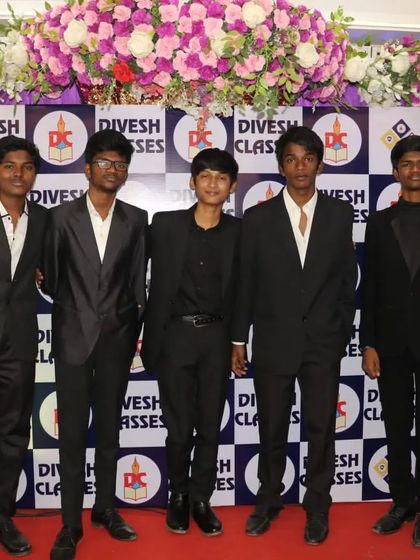 A group of friends dressed in black suits, ready for their farewell night.