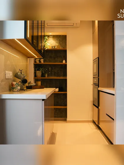 This perspective shows the kitchen's linear flow and how the different zones connect. The thoughtful layout ensures an easy workflow from the preparation area to the cooking station and storage units.