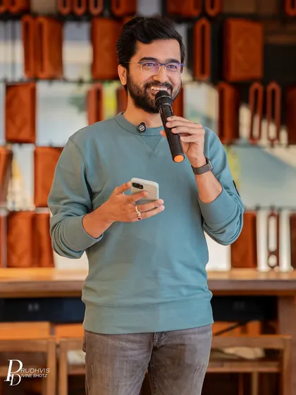 The joy of sharing your story. A performer's smile lights up the room at one of our Sunday open mic sessions, capturing the supportive and encouraging atmosphere we cherish.