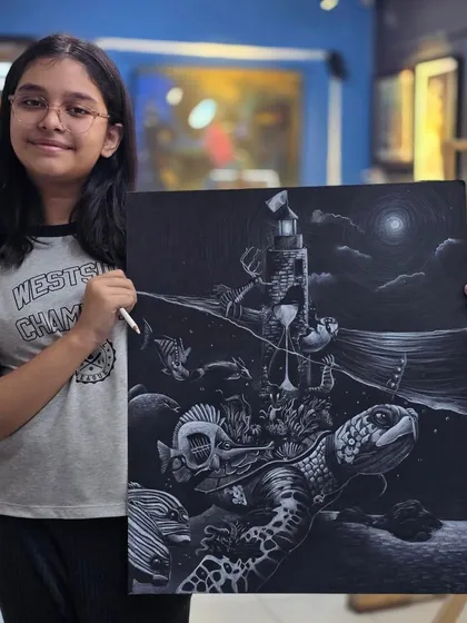 A proud young artist with her finished masterpiece. This surrealist underwater scene, drawn with a glass marking pencil, is a fantastic example of the imaginative concepts we help our students bring to life.