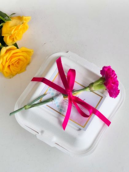 Various examples of my gift wrapping, showing different combinations of ribbons, flowers, and bags to suit any occasion.