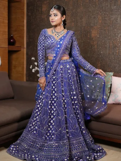 The complete look featuring the stunning blue lehenga and the detailed silver braid. This is a perfect example of how I coordinate makeup, hair, and outfit for a cohesive sangeet or reception style.