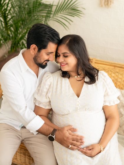An intimate and loving portrait of a couple in our bright and airy boho studio, sharing a quiet moment.
