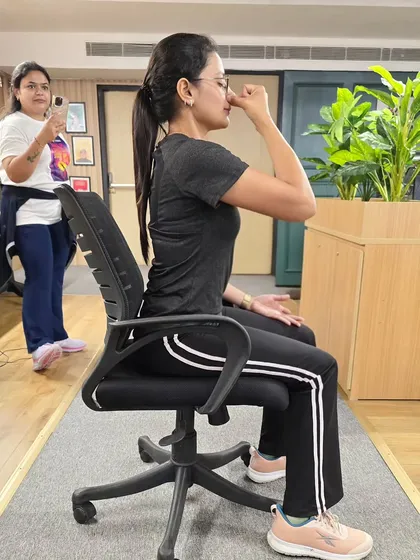 A close-up of the Anulom Vilom (alternate nostril breathing) technique. This is a powerful tool I teach to help manage stress and improve concentration right at your desk.