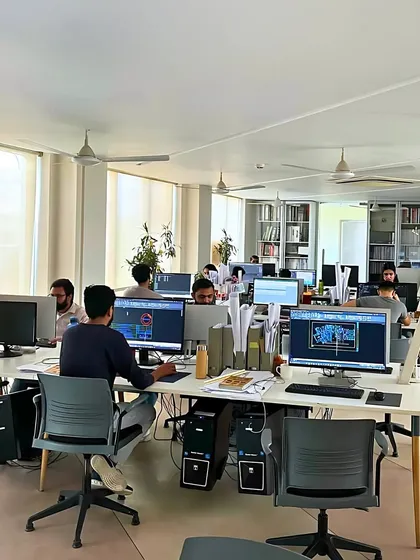 A wide shot of the studio, bustling with activity. This image captures the energy of our design process, where every space is a story of many minds at work.