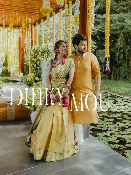 A classic couple portrait from a Haldi function, with the bride in a traditional South Indian half-saree.