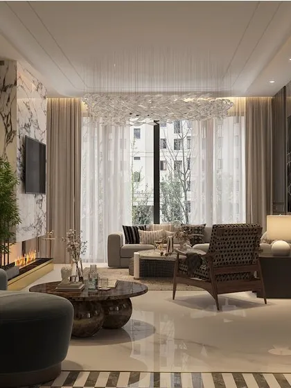Another view of the living area, showing the relationship between the seating arrangement, the modern fireplace, and the large windows. The palette is dark and moody, creating an intimate feel.