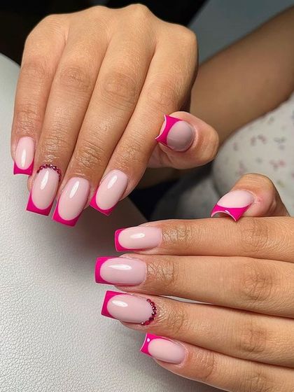 A vibrant pink French manicure on square-shaped nails, with a delicate line of pink rhinestones at the cuticle for an extra touch of glam.