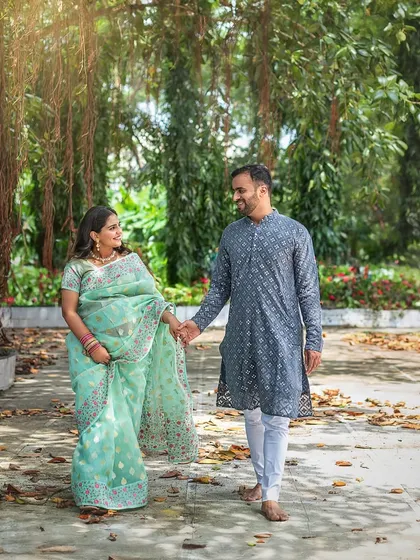 Motherhood captured with simple elegance. This outdoor maternity session shows how a beautiful saree and the natural light filtering through trees are all that's needed to create a portrait filled with grace and serenity.