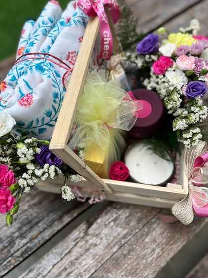 Another angle showing the cozy blanket and other comforting items nestled inside the basket.