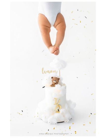 Our blessing. A creative shot from my son Ivaan's 6-month photoshoot, featuring his little legs dangling over the half-birthday cake.