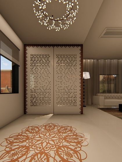This living area showcases traditional Indian design elements, such as the intricate jali screen and the mandala-inspired floor inlay. We paired these with modern furniture and lighting to create a unique fusion of styles.