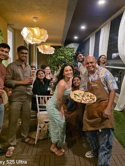 I love being part of your celebrations! Here I am with a happy group at a birthday party. My goal is to bring amazing food and a fun, memorable vibe to any event, whether it's on a balcony, in a garden, or in your living room.