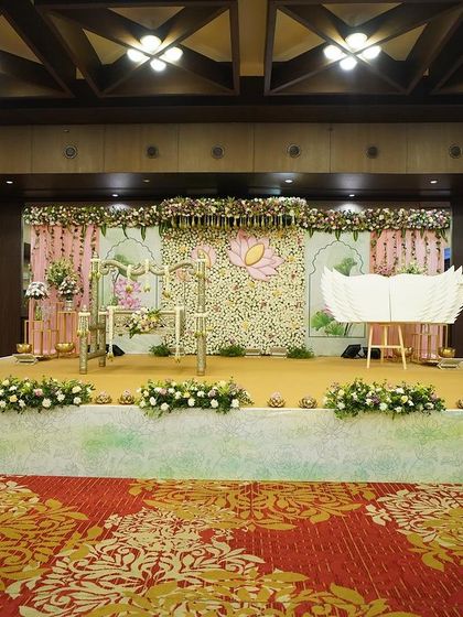 From mock-up to magic. This image shows the final, breathtaking result of the lotus-themed naming ceremony, a complete transformation of the space into an enchanting, floral wonderland.