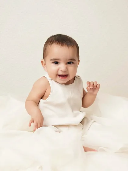 A big, happy grin from this little guy. His joy is contagious, and this photo is sure to make anyone smile.
