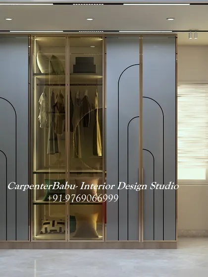 A stunning walk-in closet with glass-fronted wardrobes, internal lighting, and ample storage. This is the epitome of luxury and organization.