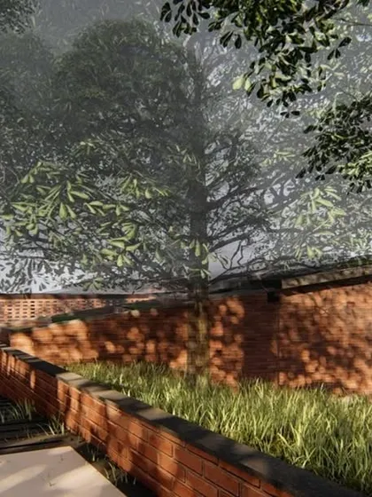 The entrance approach to the Atlanta Wellness Home is designed as a subtle incision in the landscape, with brick retaining walls guiding the path towards the building, which remains partially hidden.