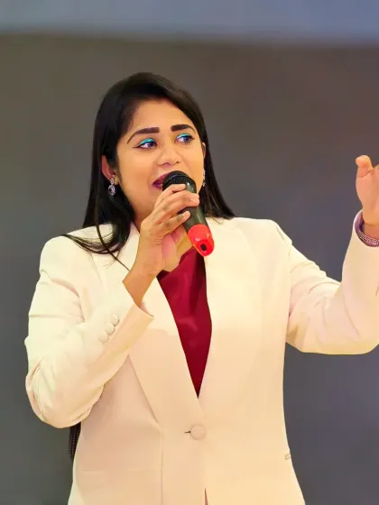 A powerful shot of me engaging the audience during the Lux Industries dealer meet. I use my voice and stage presence to command attention and keep the energy high.