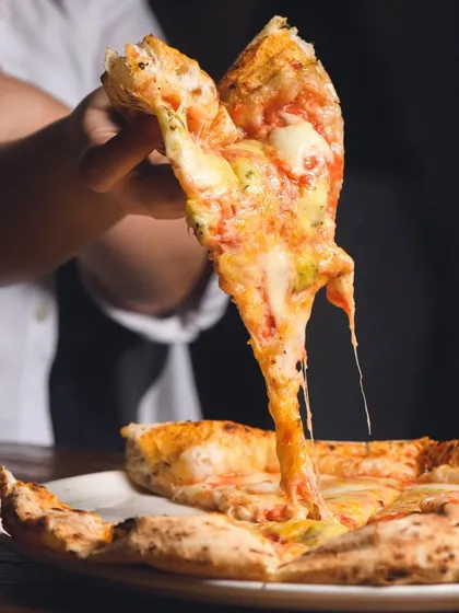 We're all about that perfect cheese pull. Our Quattro Formaggi is a celebration of cheese, with a stretchy, gooey texture that's pure happiness in a slice.