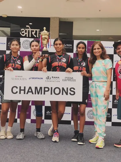 Our champion women's team celebrating their victory at the Seawoods Nexus mall event. Their skill and teamwork were on full display throughout the tournament.
