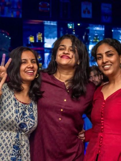 Peace and smiles from this happy group of friends.