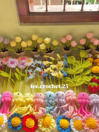 A vibrant collection of my work, including pastel jellyfish, strawberries, bees, and various flower stems.