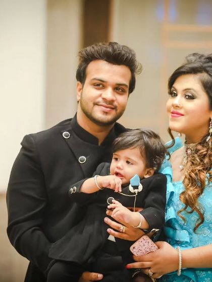 A candid family portrait during a first birthday party. We capture the natural interactions and love between parents and their child.