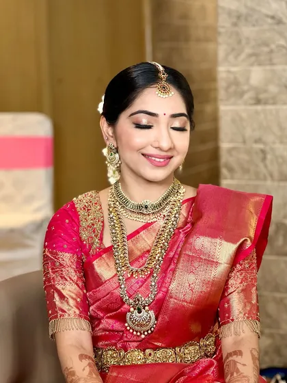 A close-up of the bride's radiant makeup. I focus on creating a smooth, long-lasting base that glows under the lights, ensuring she looks perfect throughout her wedding day.