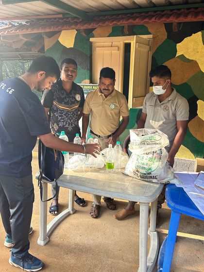 Forest officials collecting a deposit for any plastic items carried, which is refunded upon showing the items on return. A great step towards keeping the mountains clean.