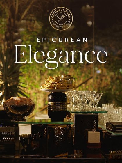 "Epicurean Elegance." A stylish dessert and appetizer station with crystal bowls and sophisticated black and gold accents.